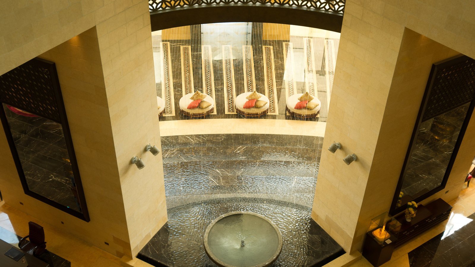 A Dubai hotel lobby with a fountain, seen from above